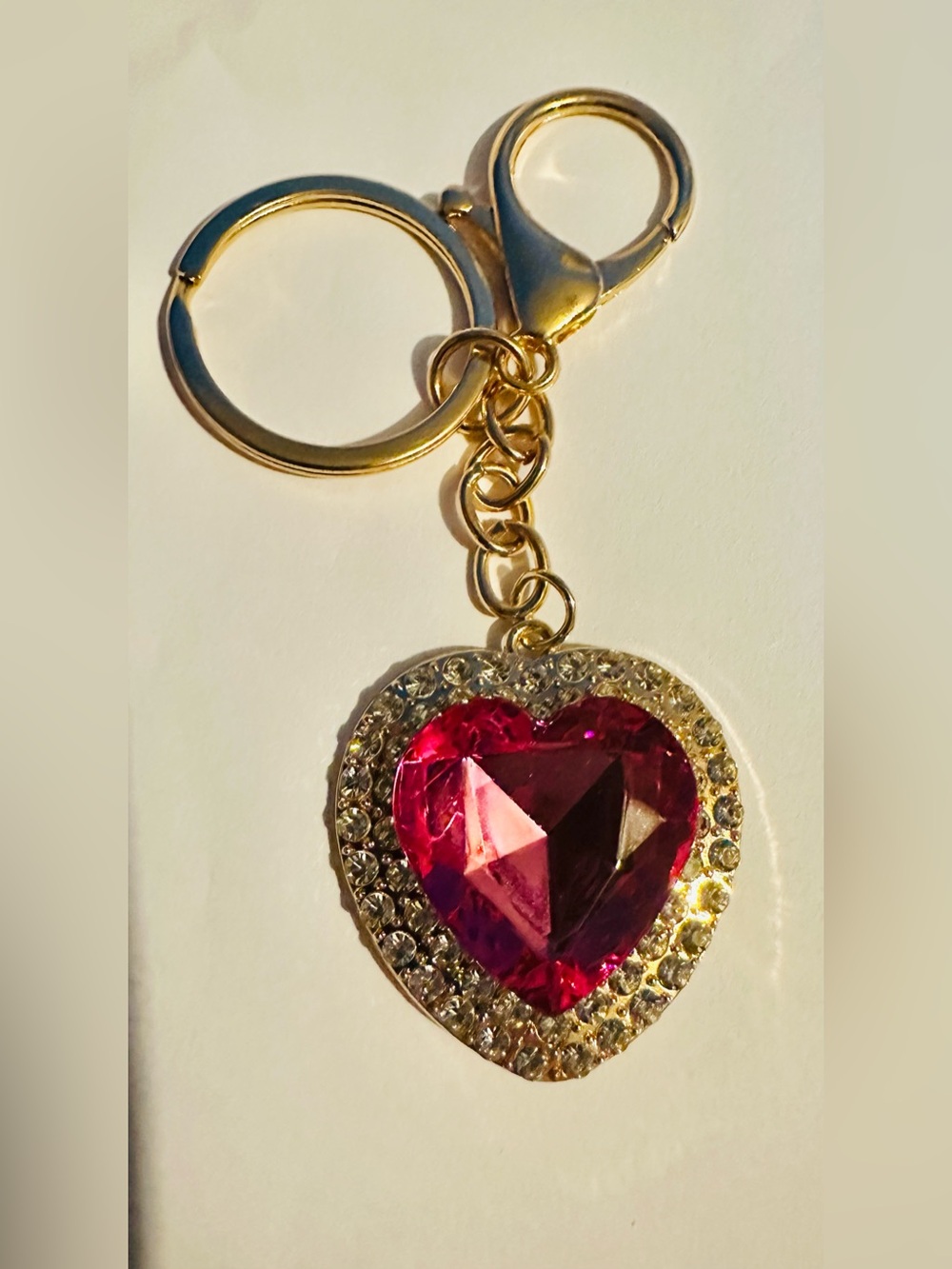 Gold Tone Heart Bagcharm/Keychain with Dark Pink Gem Surrounded by Crystals